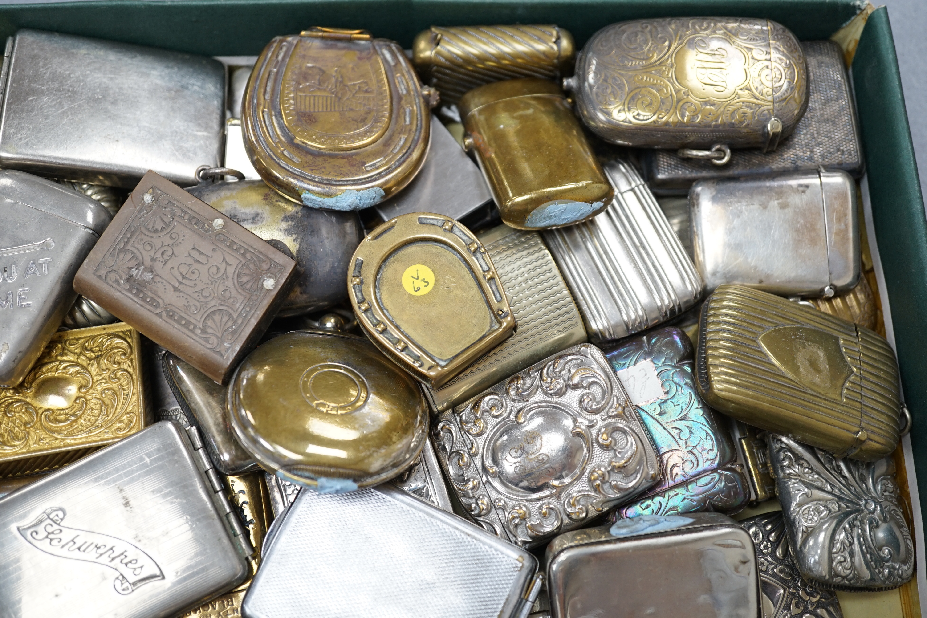 A large collection of mixed metal vestas including brass and copper